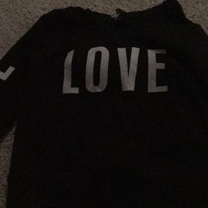 A sweatshirt with love on the sleeves and middle